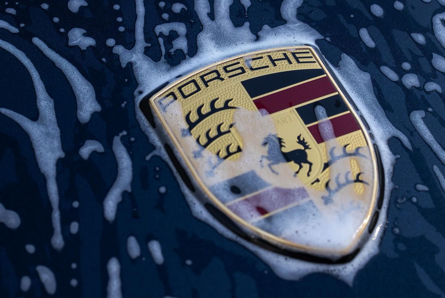 Foam wash on a Porsche during exterior detailing